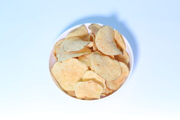 Delicious potato chips, isolated on white background 