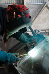 Welding Worker / Welder Doing Aluminium Weld