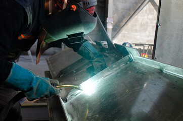 Welding Worker / Welder Doing Aluminium Weld