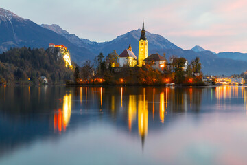 Cozy sunrise on Lake Bled against the backdrop of the castle in the Julian Alps in the Tirglav National Park