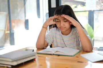 girl student studying hard feeling stressed tired exhausted bored. children education