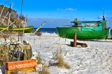 Fishing boats on the beach in Gdynia, Poland. Beautiful winter landscape. 