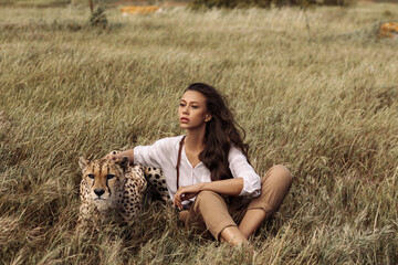 Beautiful girl with a cheetah in Africa © Alexander