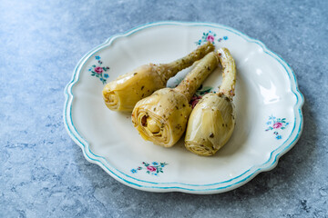 Marinated Spicy Artichoke Hearts in Olive Oil served with Root.