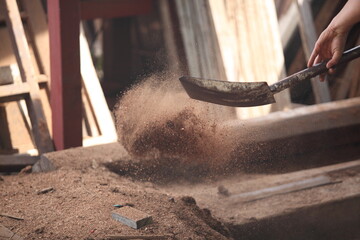 Carpenter, he is working in the workshop. Man at work on wood. Image of mature carpenter in the workshop, furniture making concept.