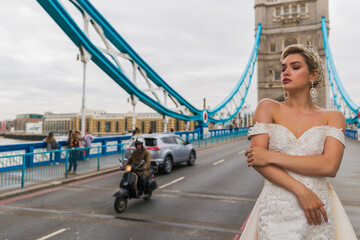bride in white dress, background Tower Bridge and car