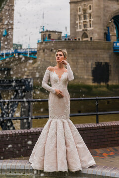 Bride In Ivory Dress, Background Tower Bridge, Girl With A Dolphin Fountain