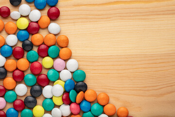 Colorful chocolate candy stones on white background