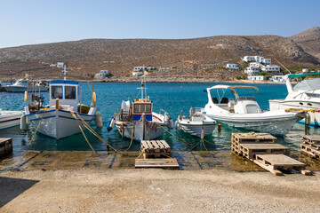 Fishing boats mooring in the port of Karavostasi on Folegandros island. Cyclades, Greece