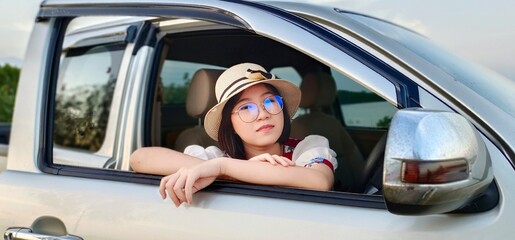 Woman enjoy life in car of travel holiday weekend.