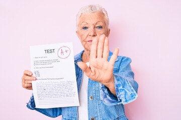 Senior beautiful woman with blue eyes and grey hair showing a passed exam with open hand doing stop sign with serious and confident expression, defense gesture