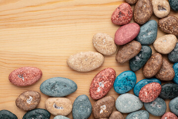 Colorful chocolate candy stones on white background