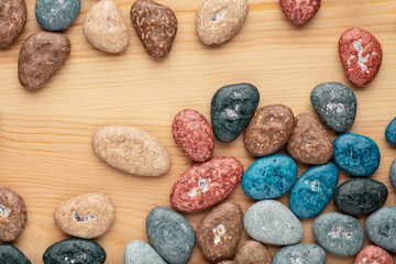 Colorful chocolate candy stones on white background