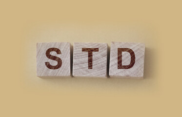 STD Sexually transmitted infections text on wooden cubes. Healthcare concept