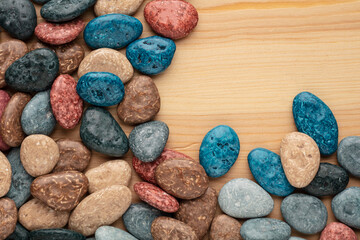 Colorful chocolate candy stones on white background