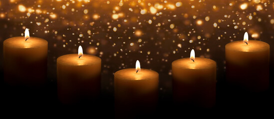Candles on a dark background with gold bokeh. Banner with a space for the text.