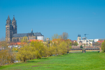 Fototapeta na wymiar Historical downtown of Magdeburg, old town, Elbe river, and Magnificent Cathedral at early Spring with blue sky and sunny day, Magdeburg, Germany.
