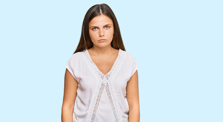 Obraz premium Young caucasian woman wearing casual clothes depressed and worry for distress, crying angry and afraid. sad expression.