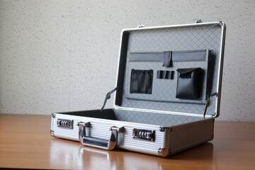The secret briefcase is placed on the desk to hide information when moving documents or not wanting...