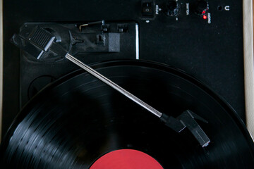working retro vinyl record player, black record with red center