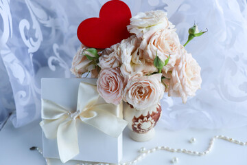 Happy Valentine's Day greeting card. bouquet of flowers and red heart on white background 
