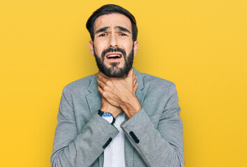 Young hispanic man wearing business clothes shouting suffocate because painful strangle. health problem. asphyxiate and suicide concept.
