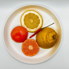 Still life: Lemon, tangerine and bitter pepper