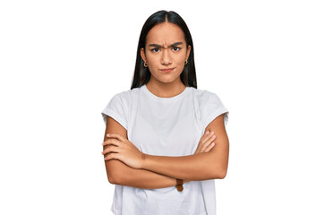 Young asian woman wearing casual white t shirt skeptic and nervous, disapproving expression on face with crossed arms. negative person.