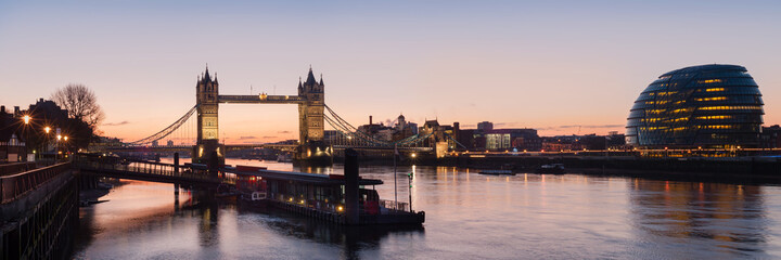 London - Panorama view along the river thames showing Tower Bridge and City Hall with Tower Millennium Pier in the foreground