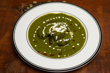 Palak paneer or Spinach and Cottage cheese curry is a healthy main course recipe in India, served.