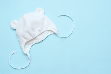 Fototapeta premium Children's white cap on a blue background