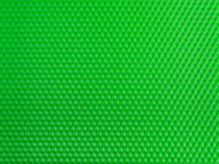 Futuristic surface. Bright green geometric honeycomb background. Template