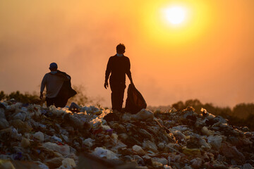 Poor people collect garbage for sale People living in garbage heaps walking to collect recyclable...