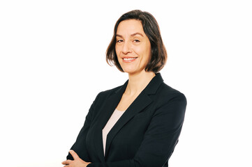 Studio portrait of 45 - 50 year old woman posing on white background, wearing black jacket