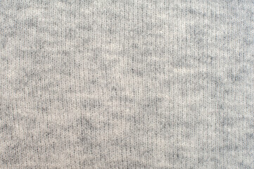 Knitted seamless pattern in gray. Textures for wallpapers and backgrounds. 