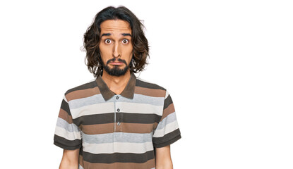 Young hispanic man wearing casual clothes depressed and worry for distress, crying angry and afraid. sad expression.