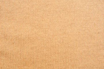 Beige knitted texture. The background can be used as wallpaper. 