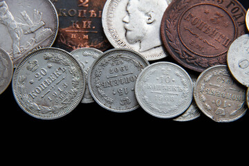 Background from old money of Imperial Russia. 19 - 20 century.Vintage multi-colored Russian coins...
