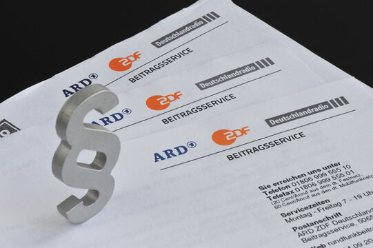 Hamburg /Germany - September 30, 2018: Paragraph sign and letters with the logo of Contribution Service of ARD, ZDF and Deutschlandradio - Germany's public broadcasting institutions