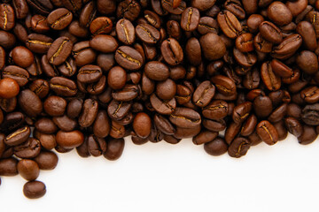 Obraz premium Coffee beans isolated on white background with copyspace for text. Coffee background or texture concept.
