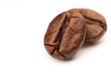 Obraz premium roasted coffee beans isolated on white background cutout