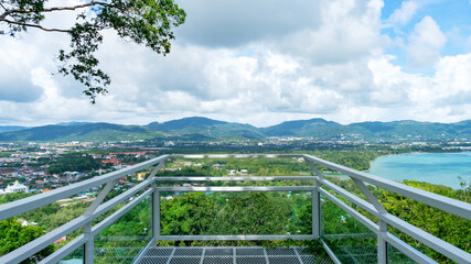 Fototapeta na wymiar Terrace over looking view with a beautiful landscape scenery view of Tropical sea and mountain blue sky white clouds in Phuket Thailand