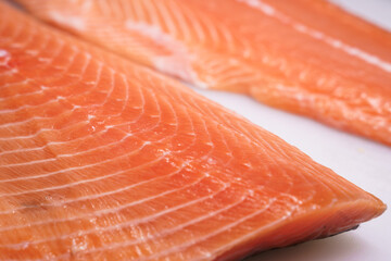 fresh salmon, salmon fillet, sliced appetizing salmon lying on the table in the kitchen