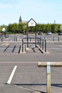 Empty Shopping Cart Bay In Deserted Retail Car Park 