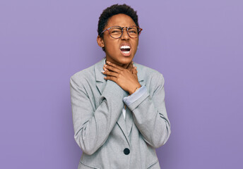Young african american woman wearing business clothes shouting suffocate because painful strangle. health problem. asphyxiate and suicide concept.