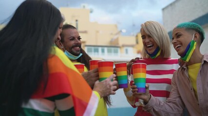 Happy people with different age cheering and drinking cocktails in gay pride festival during corona virus outbreak