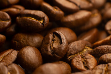 Roasted coffee beans heap isolated on white background can be used as background