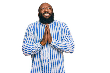 Young african american man wearing business shirt begging and praying with hands together with hope expression on face very emotional and worried. begging.