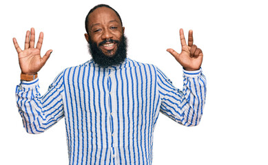 Young african american man wearing business shirt showing and pointing up with fingers number seven while smiling confident and happy.