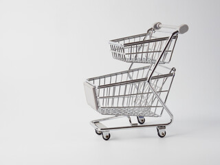 An empty grocery cart from a supermarket. There is a shortage of products in the store due to the coronavirus epidemic. Quarantine and isolation of the population in cities of many countries.